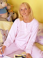 Cute small titted chick plays with her blue dildo at home.