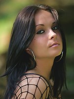 Stunning young brunnette gets naked in the outdoors