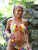 Blond and blue-eyed teen Pinky June fully naked on the rocks