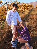 This blonde nympho had a secret for her lover. Underneath her dress, she wasn't wearing any panties and she wanted him to take advantage of the easy access even though they were outdoors.