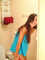 Judy sitting on the toilet