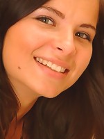 Judy sitting on the toilet