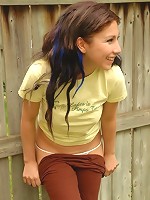 Brandy covers her teen tits outdoors