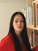 Sophisticated oriental teen poses in panties