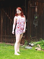 This redhead cutie has masturbated outdoors before, but never in the middle of a front lawn like she is today. She`s out in the open, rubbing her clit and fingering her tender pussy.