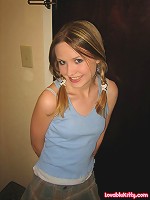 Lovable Kitty in front of hotel door