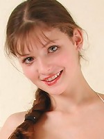 Busty teen brunette posing in bikini