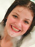 Adorable teen having fun in a bubble bath