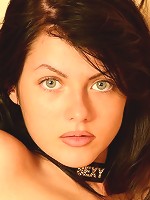 Sensual brunette babe strips out of her clothes revealing her curves