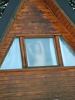 Exposing teen in front of window