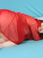 Brunette enjoys riding a pink toy