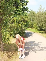 Chick stroking her snatch outside