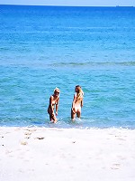 Two cute teen girls on the beach