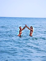 Two cute teen girls on the beach