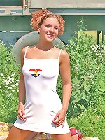 Teen redhead toying in the garden