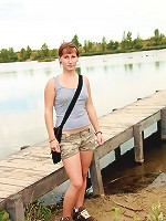 Teen near a lake pleasures cooch