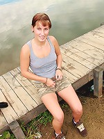 Teen near a lake pleasures cooch