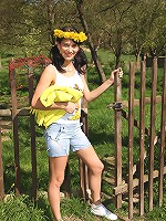 A teenager playing outdoors naked