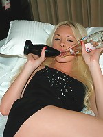 Kelly pulls out her huge black toy and gets ready to fuck it.