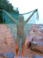 Stunning beauty strips her body naked on the seaside