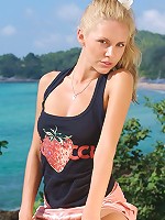 Young blonde posing nude outdoors