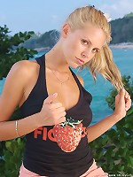 Young blonde posing nude outdoors