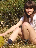 Outdoor girl Juliya plays in the field