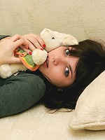 Hot and sexy 18yo girl posing on her sofa after shower