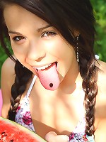 Barely legal teen Kiki touching herself in the garden