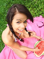 Sweet and naked teen laying on the ground outdoors