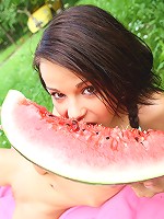 Sweet and naked teen laying on the ground outdoors