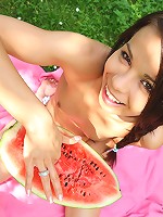 Gorgeous 18 year old cutie eating watermelon outdoors