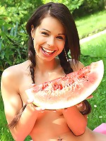 Gorgeous 18 year old cutie eating watermelon outdoors