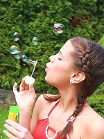 Little Caprice playing with dildo outdoors