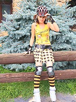 Little Caprice bends over and touches herself where she pees