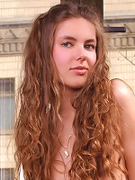 Zemani.com Alena - Young fresh slim beauty in striped socks poses on the balcony.